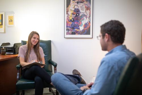 seated conversation between clinician and patient